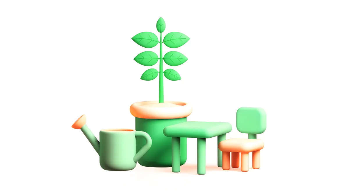 A young sapling in a pot beside a small classroom desk and chair, with a watering can.